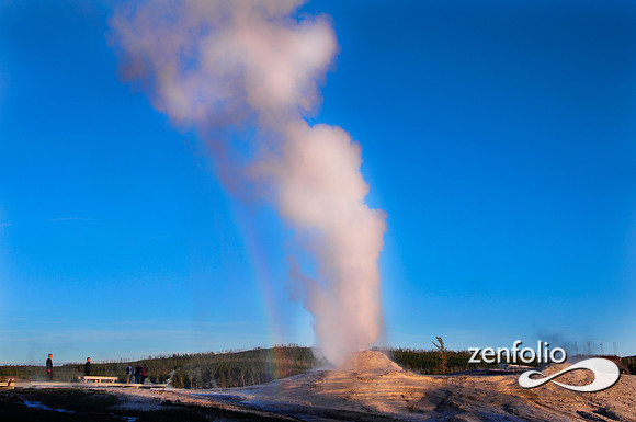 lion geyser rainbow at sunset.