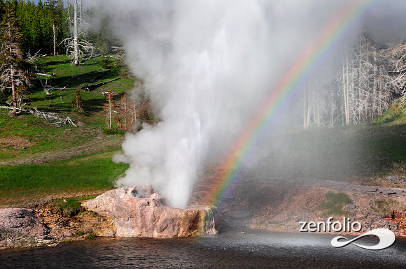 riverside geyser rainbow at sunset.