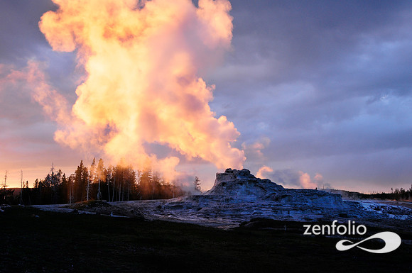 castle geyser steam at sunset.