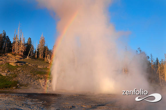 grand geyser sunset rainbow eruption.